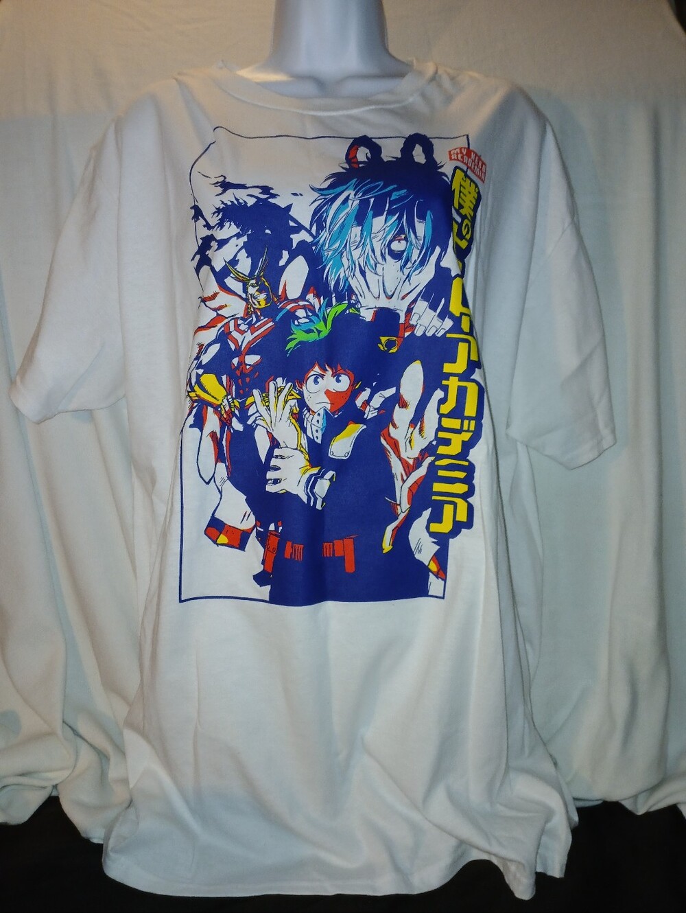 Pre-loved White Anime Graphic Unisex T-Shirt with Blue & Yellow Print.